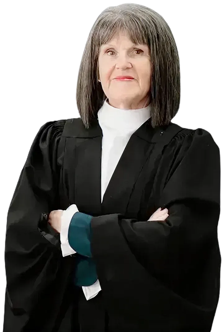 Professional older woman with gray hair wearing a black judicial robe and white collar, arms crossed.